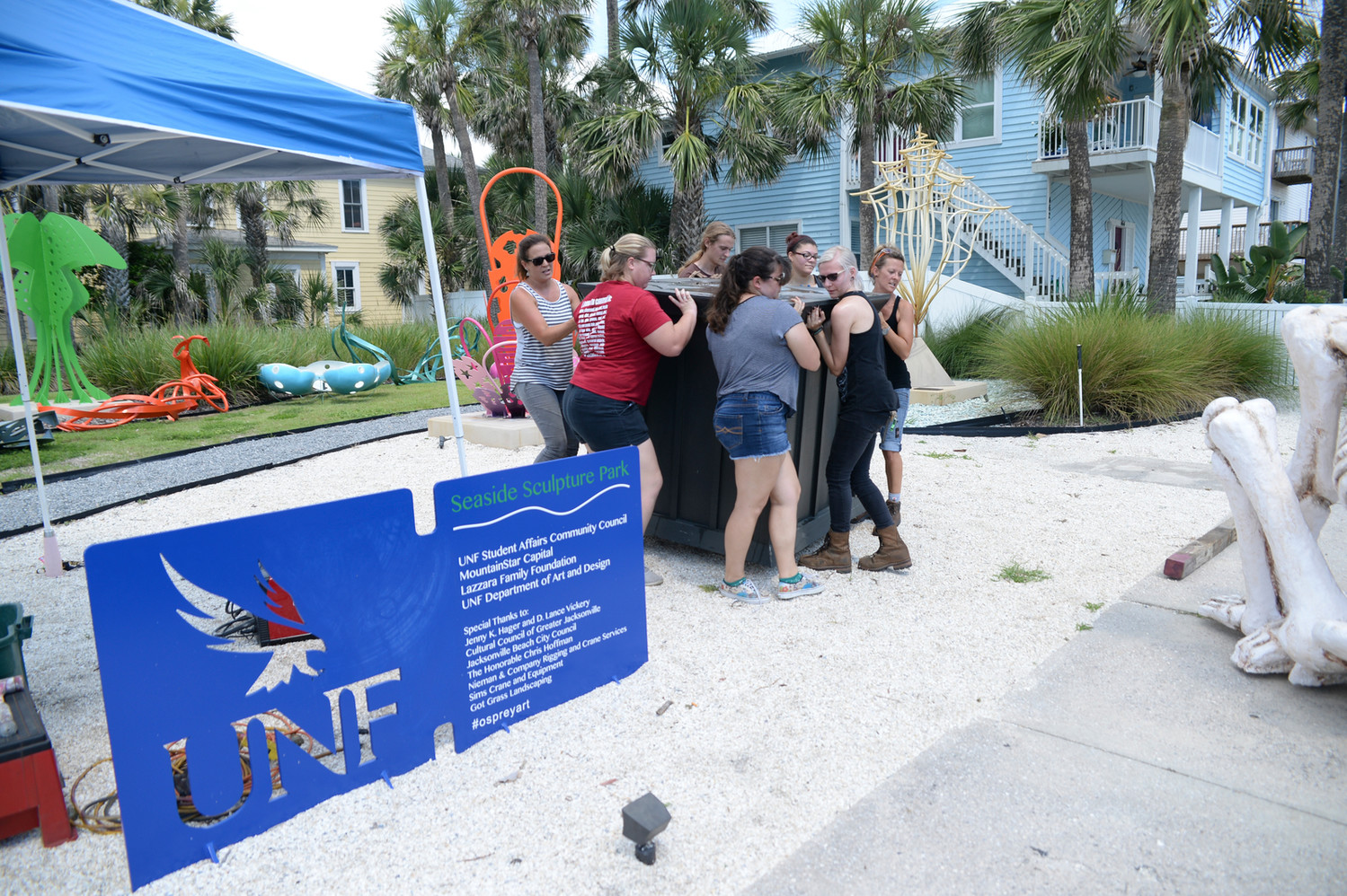 A group of students in the UNF Sculpture Program get ready to install two new sculptures at the UNF Seaside Sculpture Park in Jacksonville Beach.